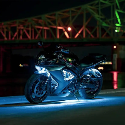 Black sport motorcycle with Underglow blue LED underglow lighting at night