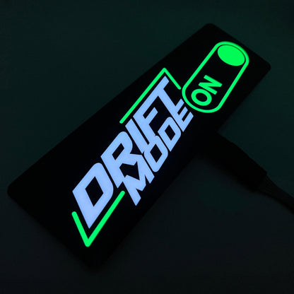 USB-powered Underglow Drift Mode LED decal with glowing white and green text and a switch icon
