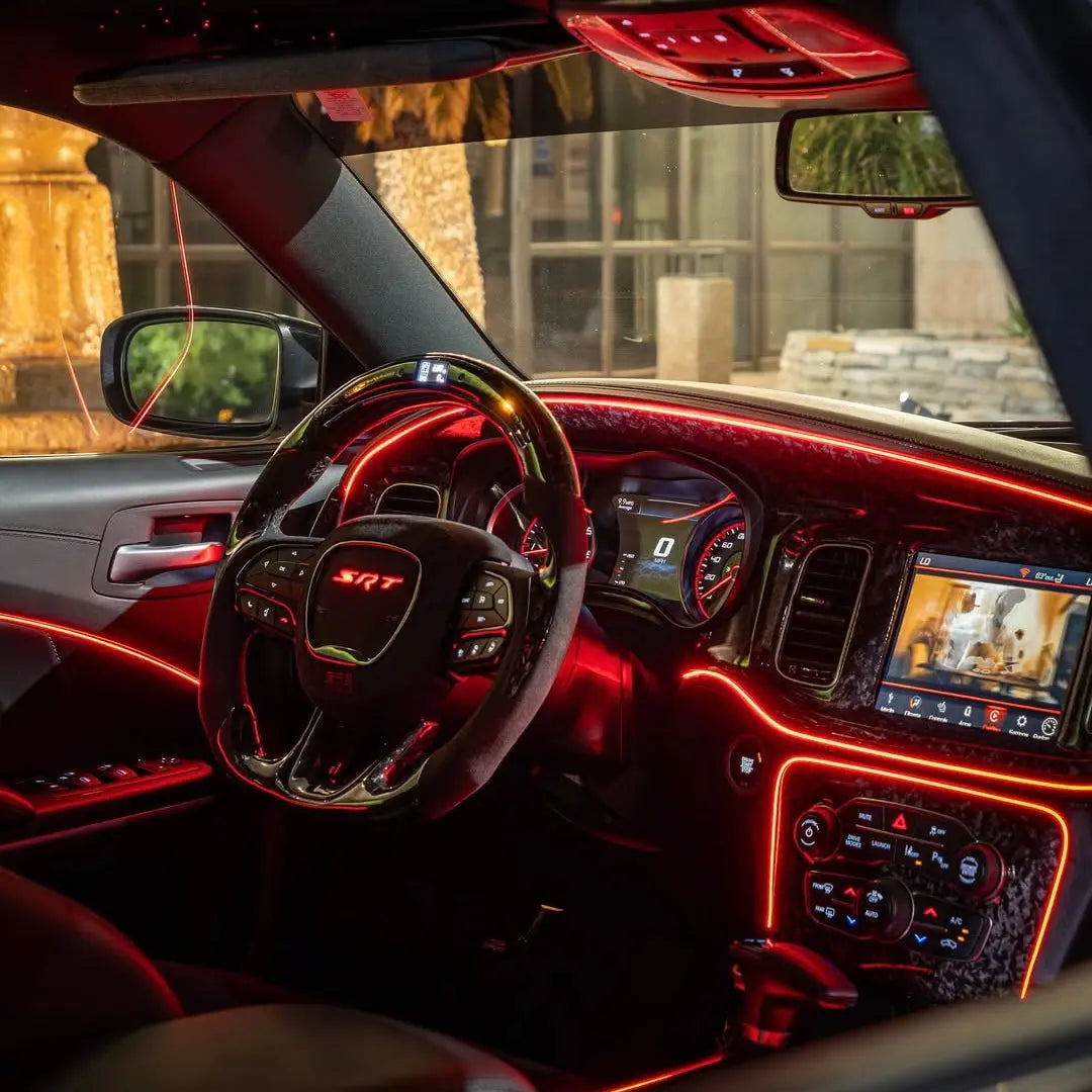 Dodge Challenger interior with red Underglow LED ambient lighting on the dashboard and steering wheel