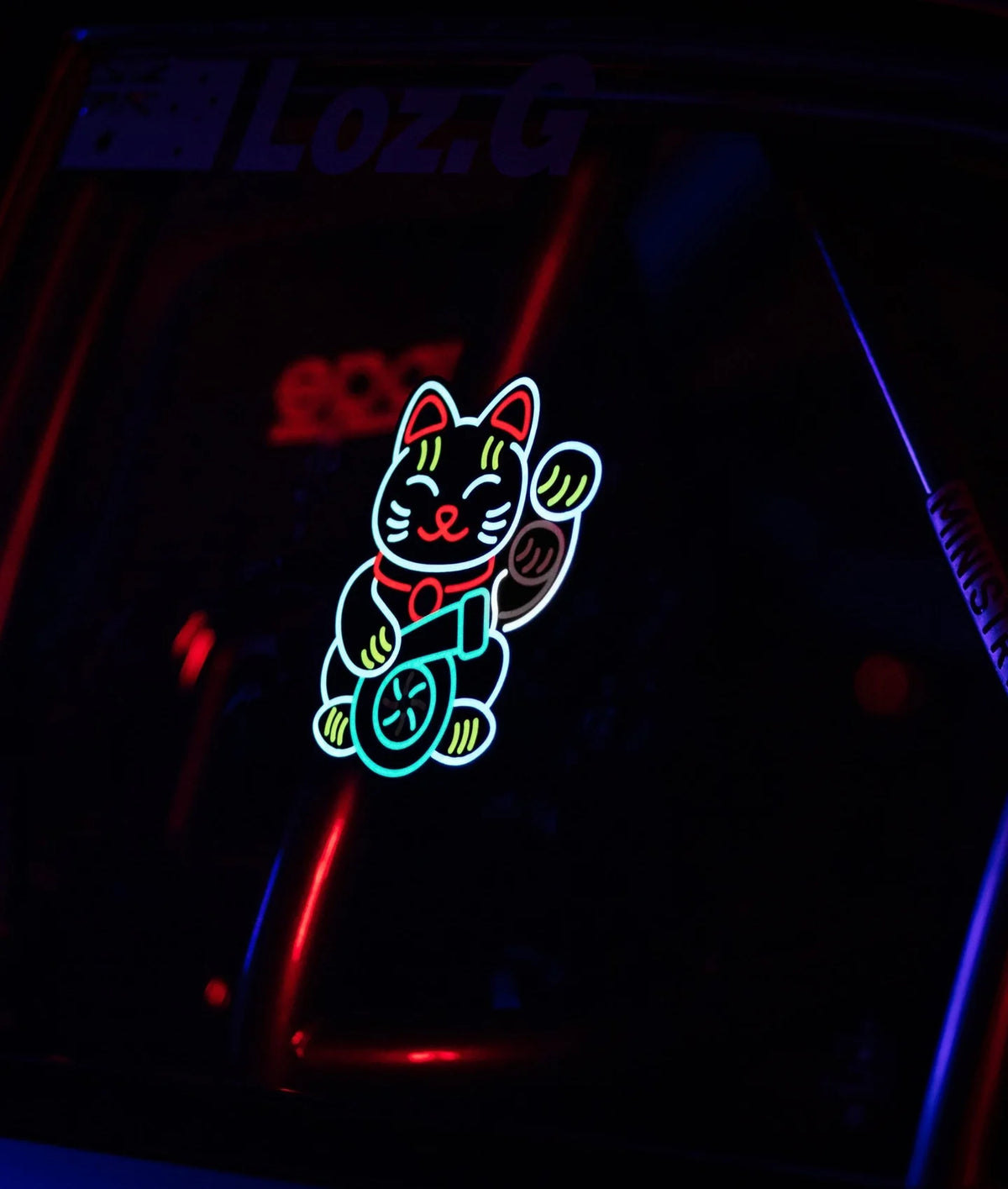 Underglow Lucky Cat USB powered LED decal glowing on a dark car interior surface